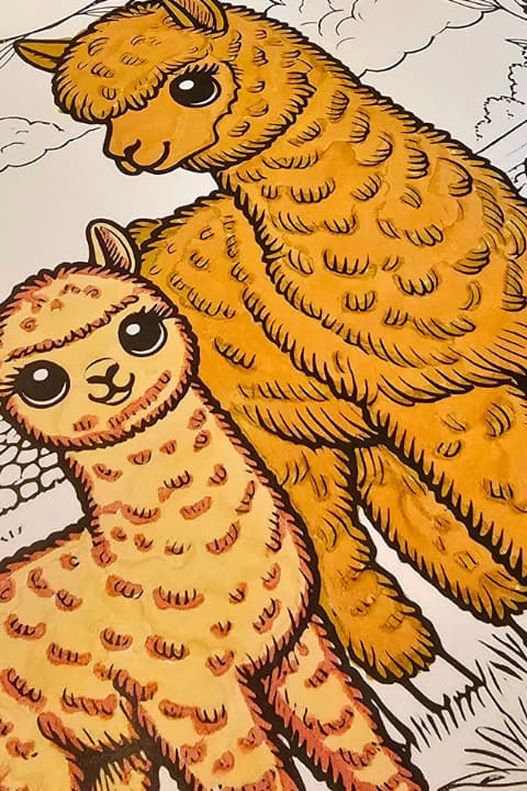 Coloring book and markers with alpaca cria